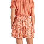 falda-floral-naranja-co-sw22-5392-5